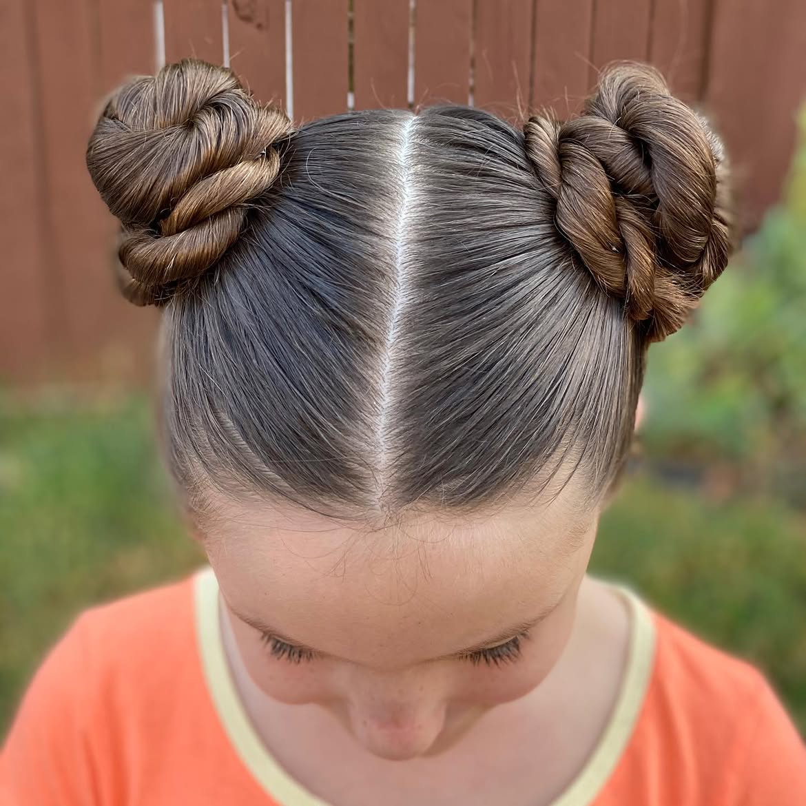 Braided Double Space Buns With Middle Part