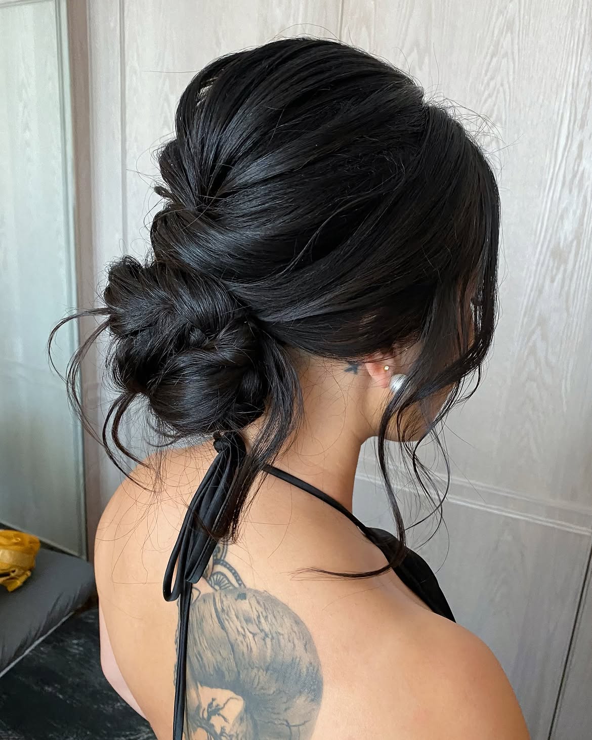 Braided Low Messy Bun With Face-Framing Strands