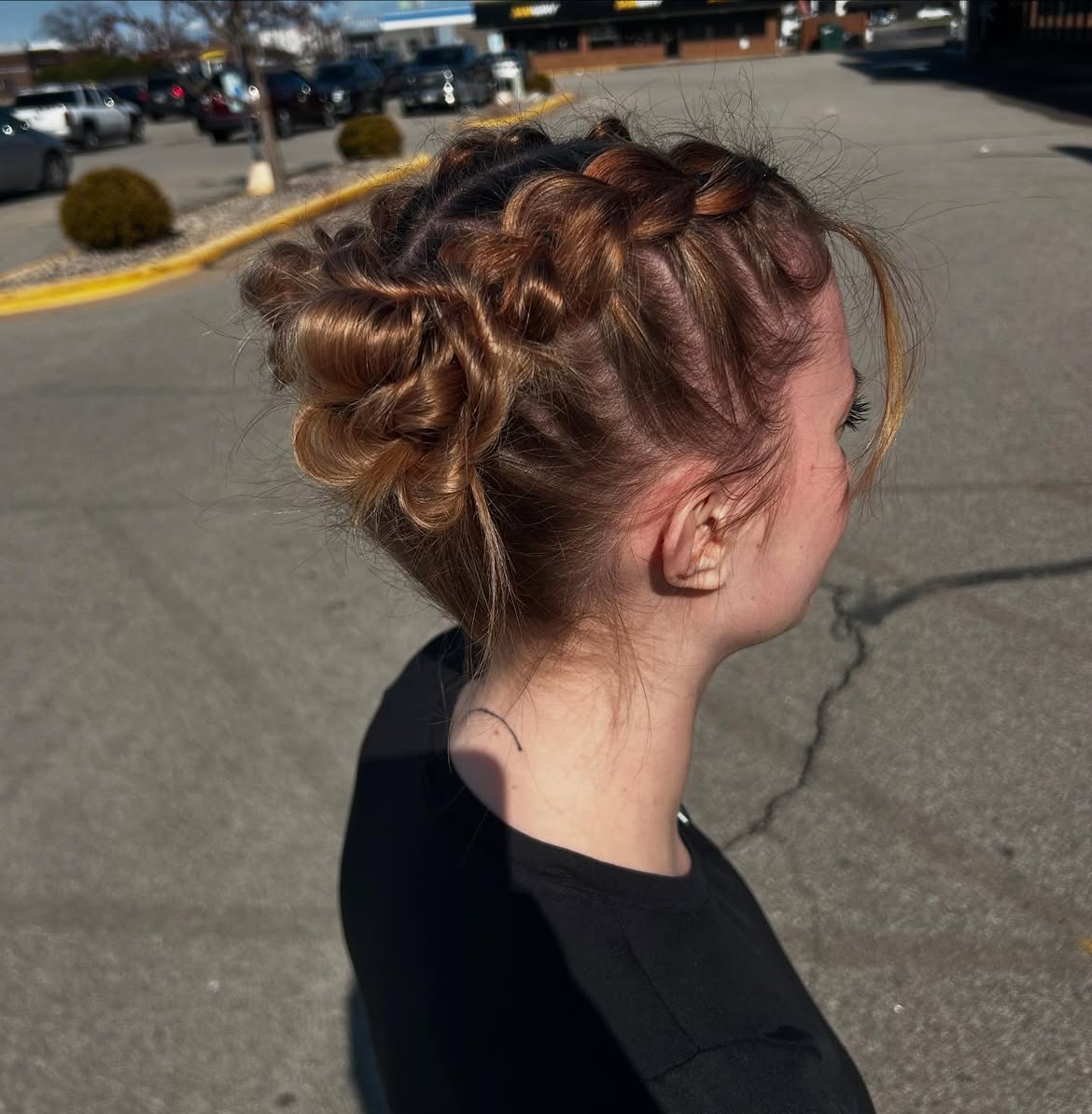 Braided Space Buns With Wispy Face Framing Strands