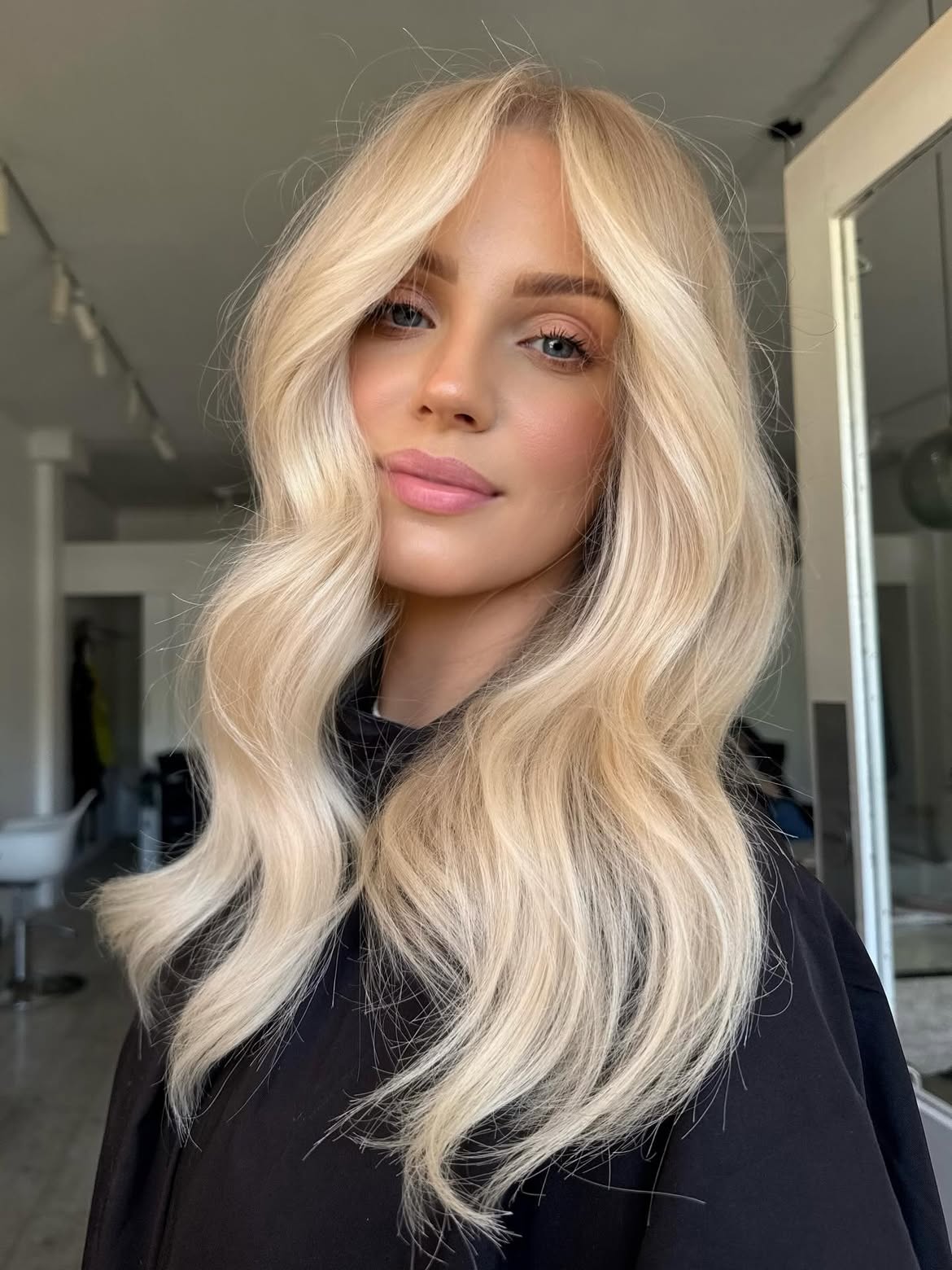 Bright Creamy Blonde Waves With Soft Curtain Bangs