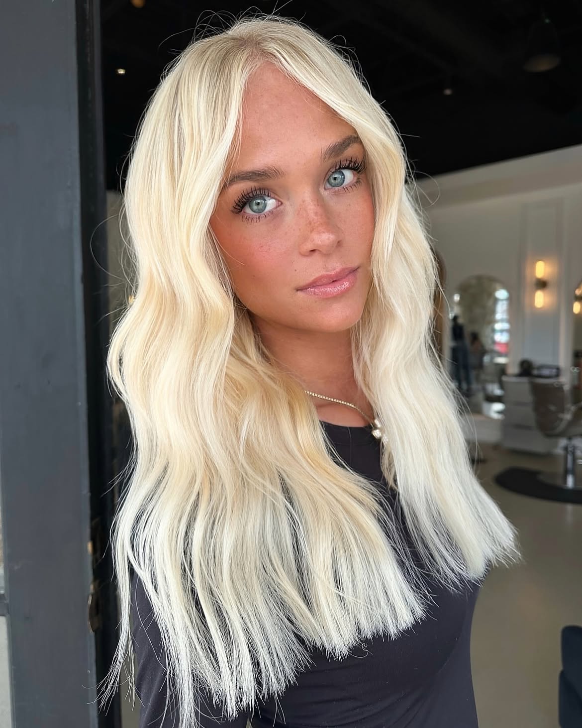 Bright Platinum Blonde Waves With Curtain Bangs