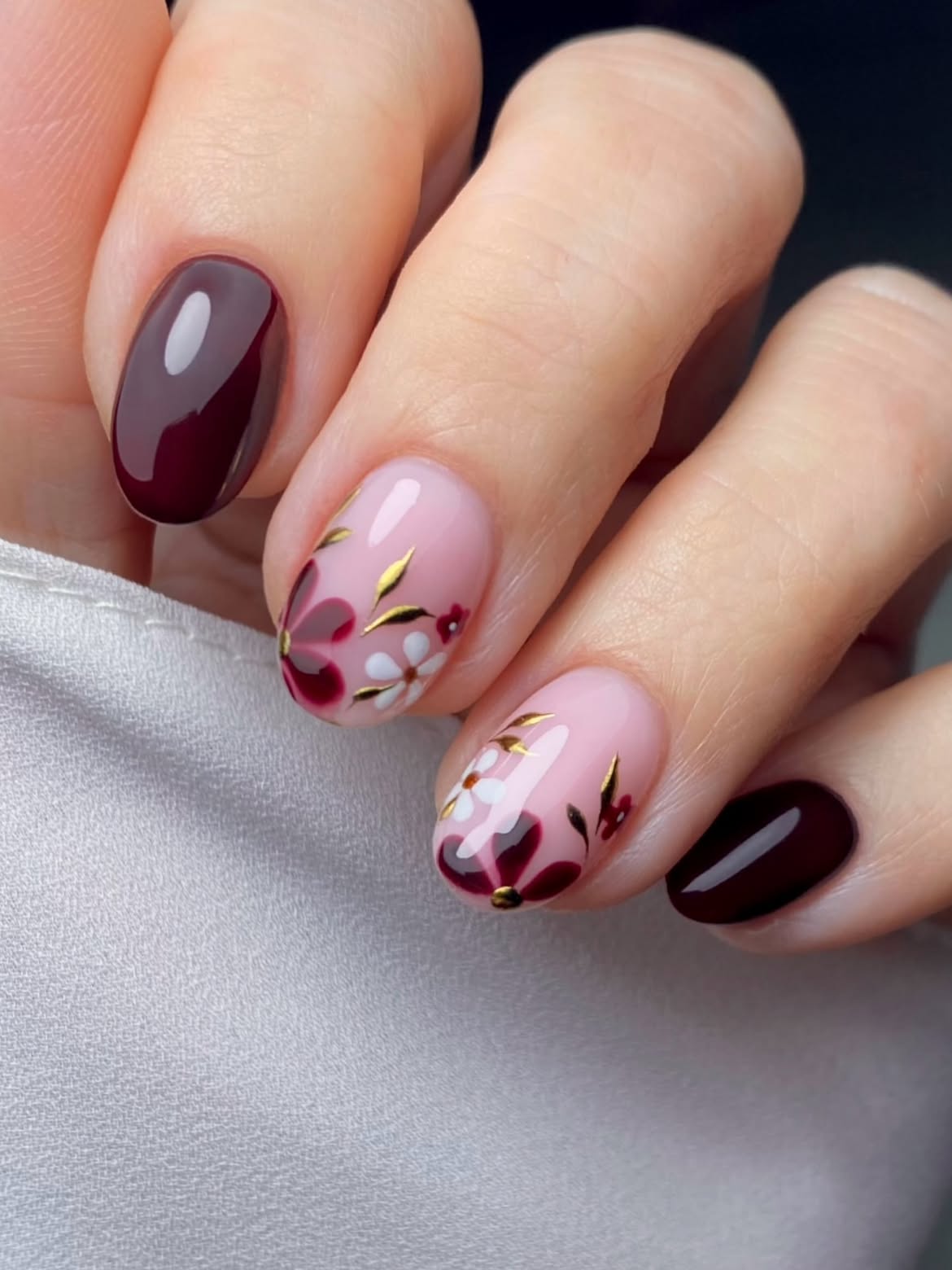 Burgundy Floral Oval Nails with Gold Accents