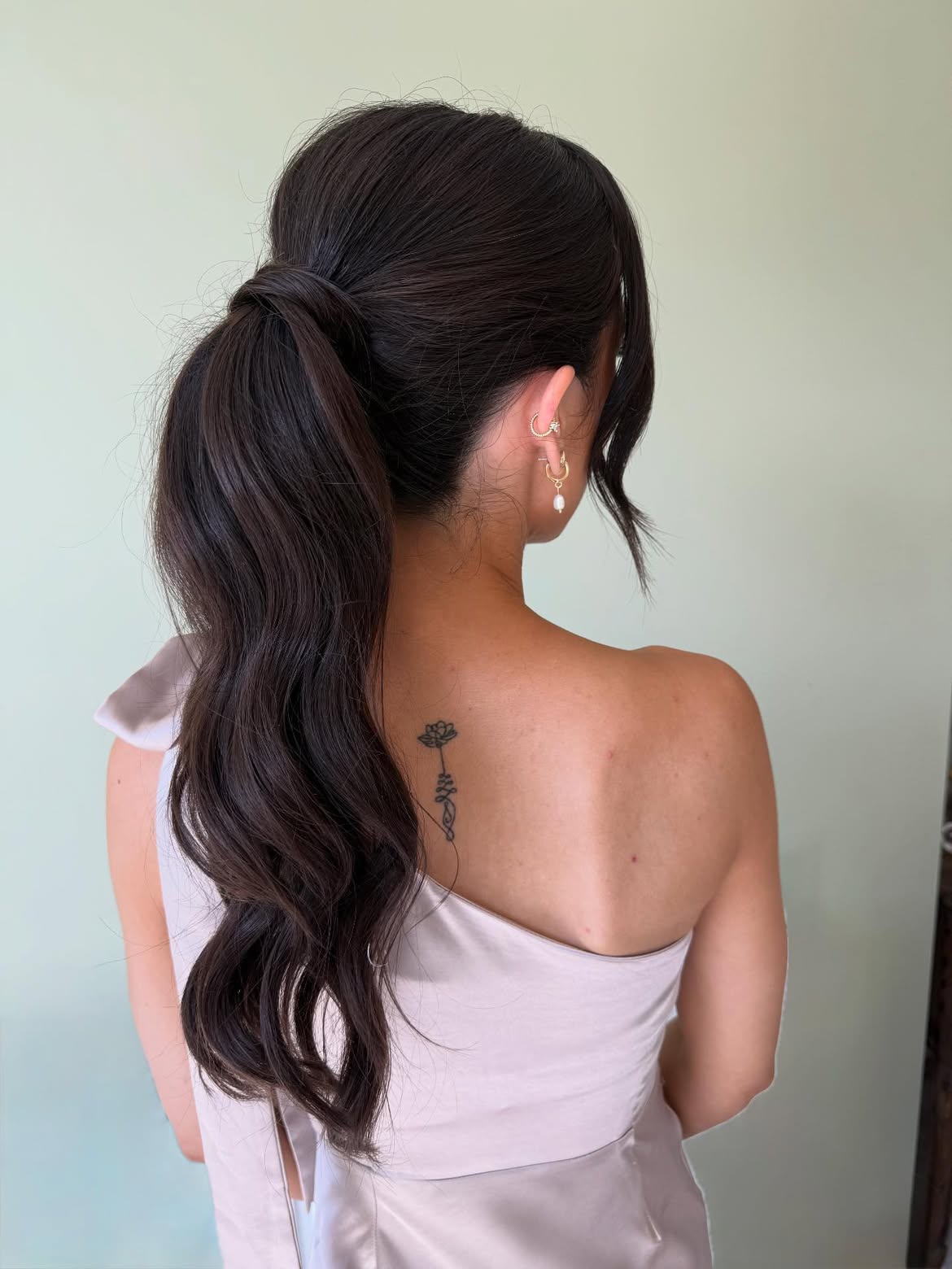 Chic Wrapped High Ponytail With Loose Waves