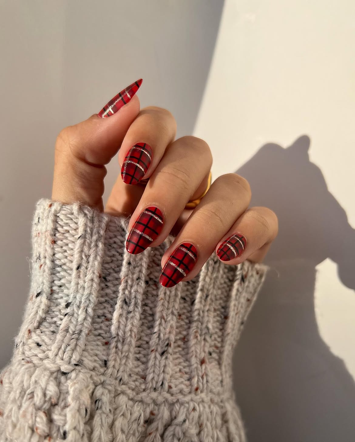 Cozy Red Plaid Almond Nails with Silver Stripes