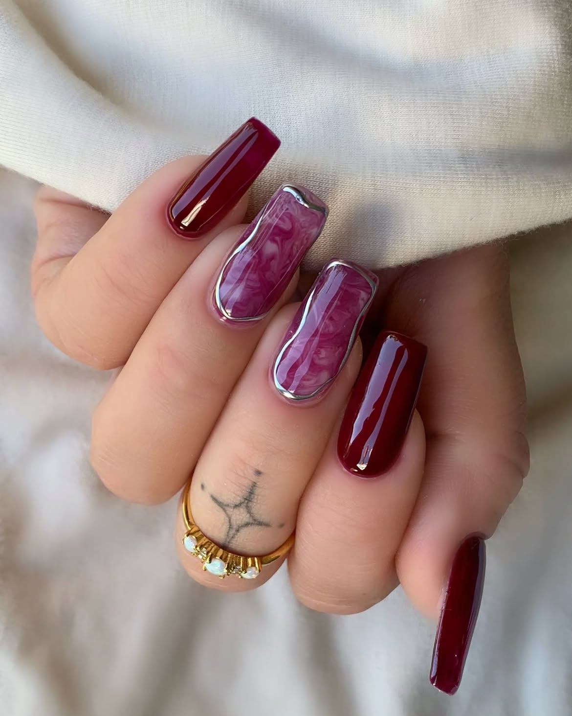 Deep Cherry Marble Swirl Nails with Silver Chrome Accent