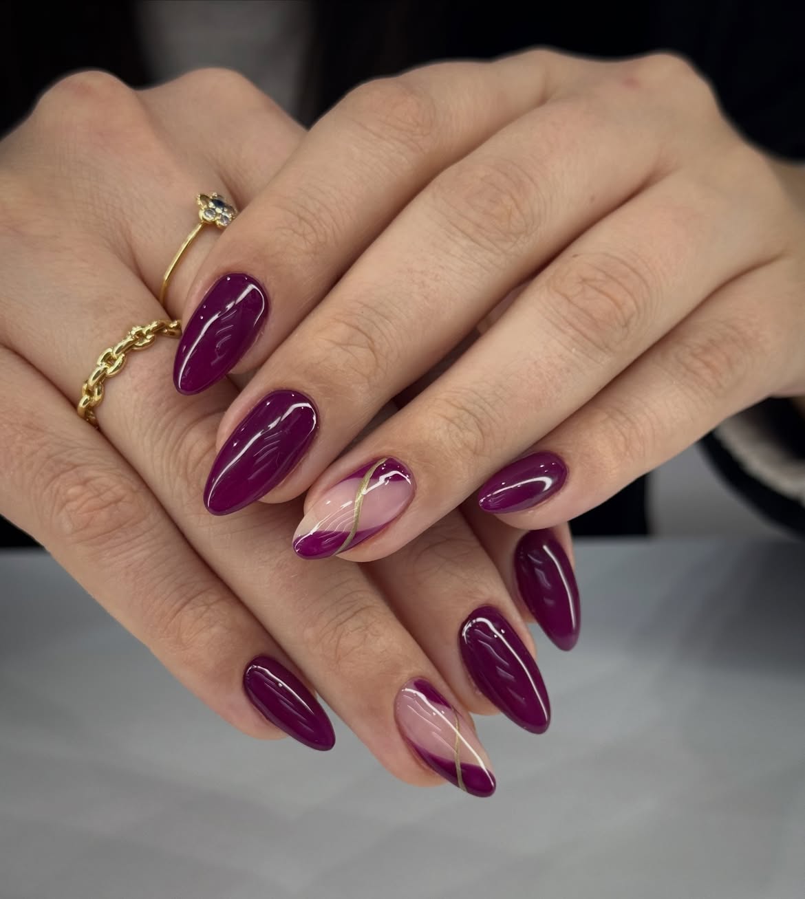 Deep Plum Almond Nails with Gold Line Art