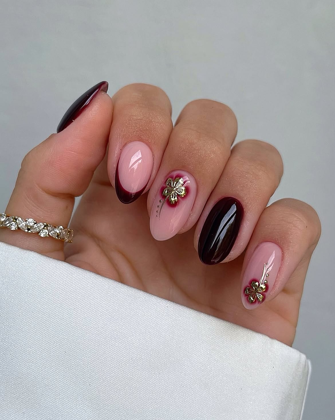 Deep Red and Nude French with Gold Clover Charms