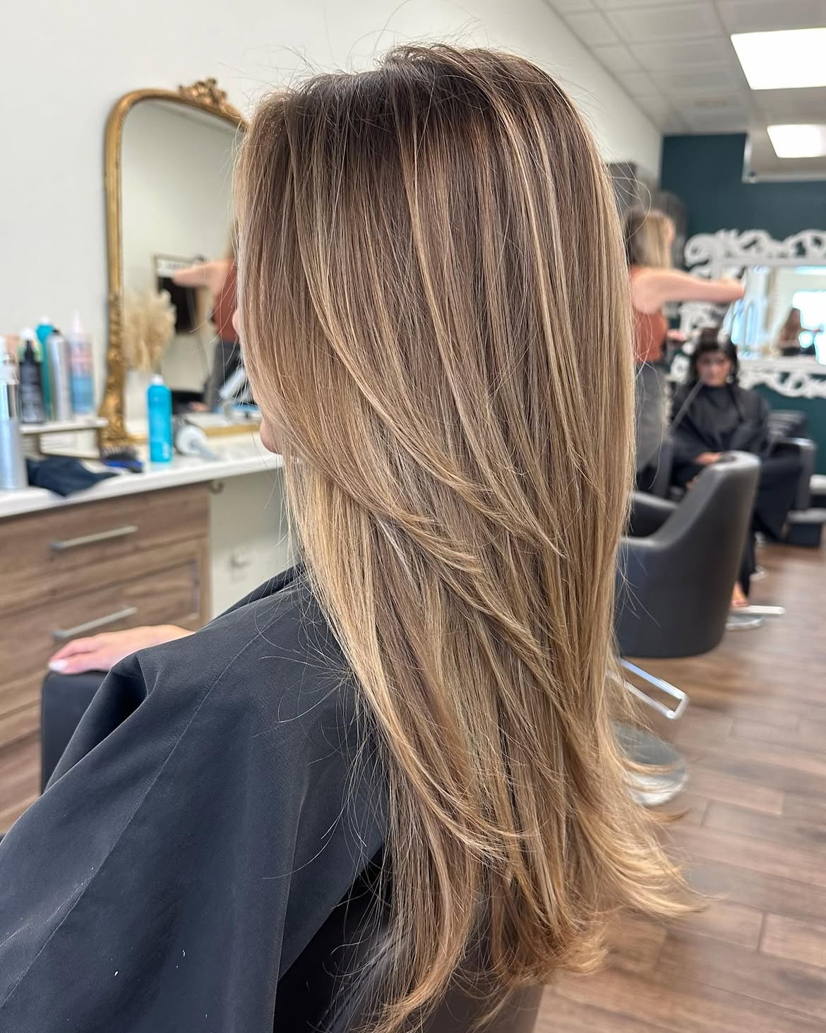 Dimensional Ash Blonde Highlights On Long Layered Cut
