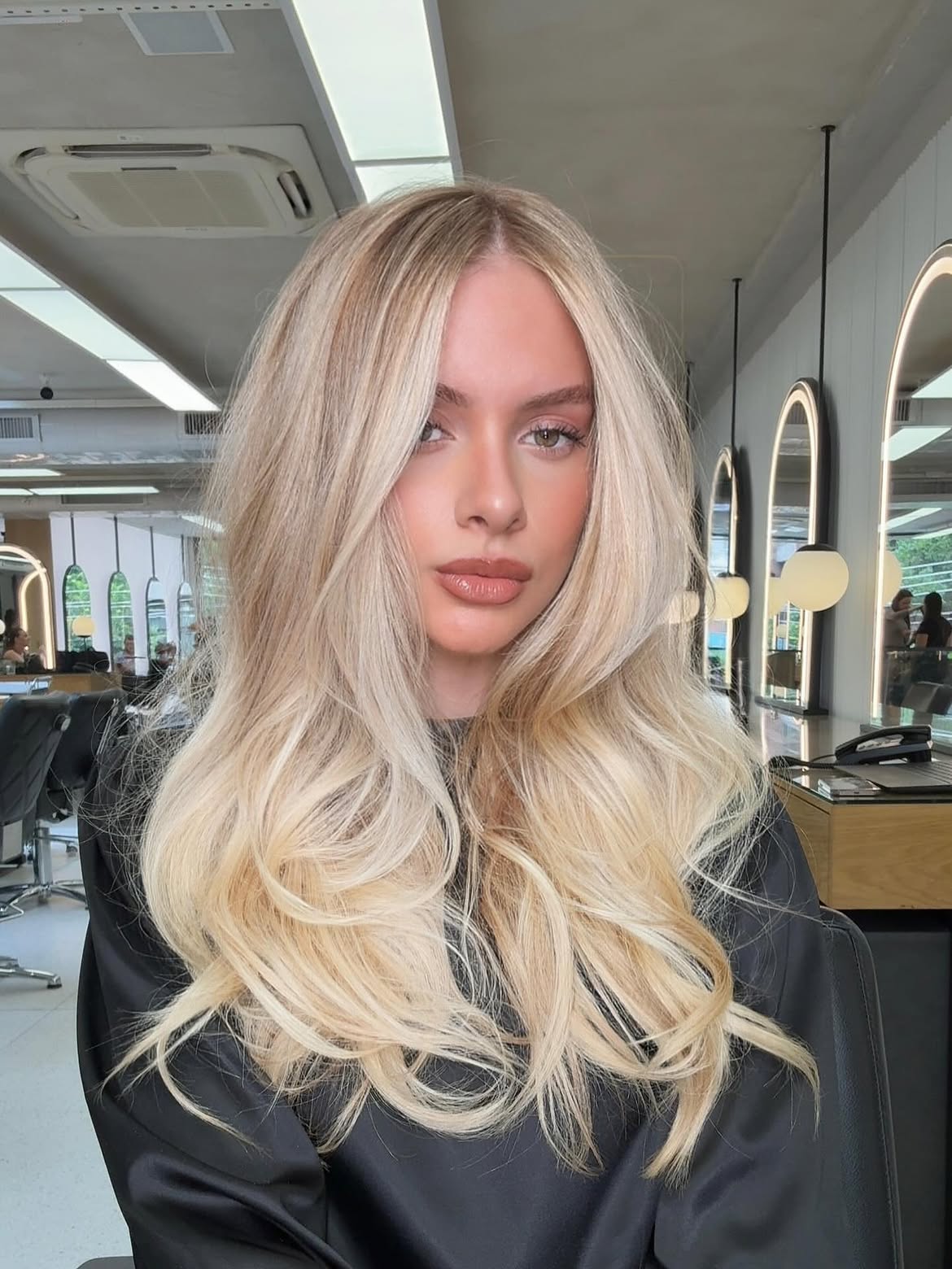 Dimensional Bright Blonde With Face Framing Layers