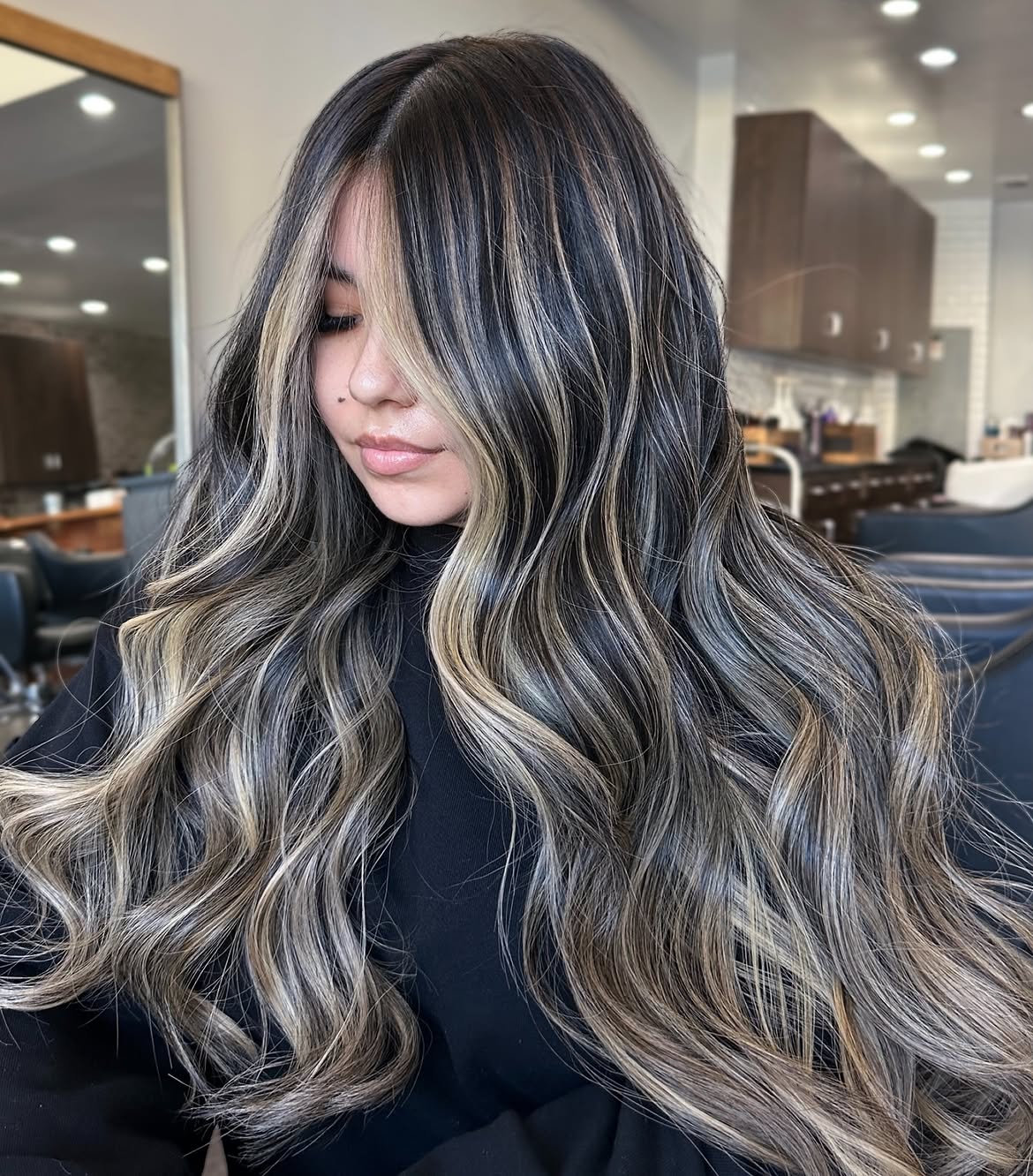 Dimensional Highlights On Long Wavy Dark Hair