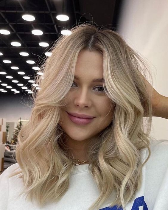 Effortless Blonde Waves With Face Framing Layers