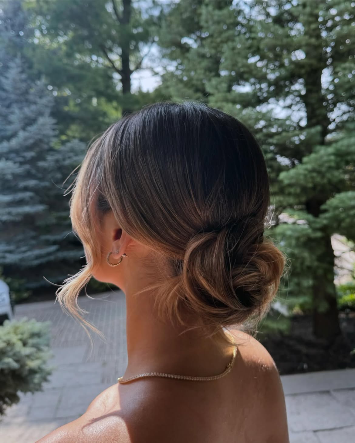 Effortless Low Bun With Face-Framing Tendrils