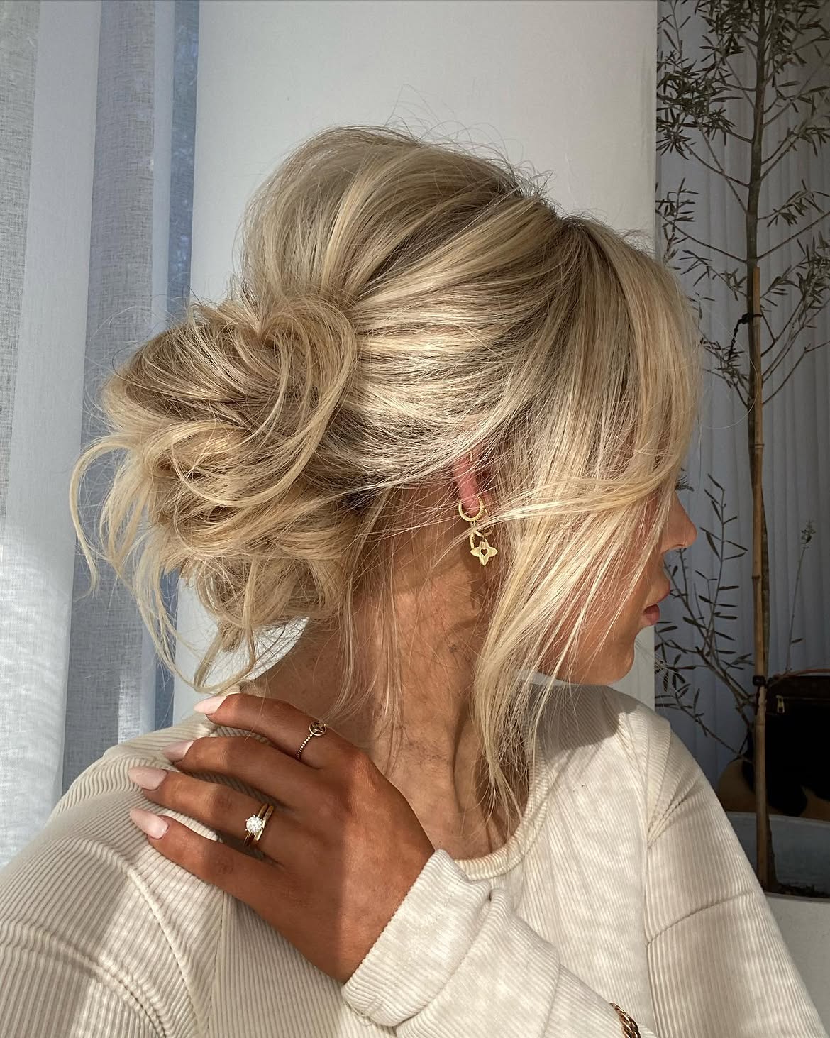 Effortless Messy Bun With Face-Framing Strands