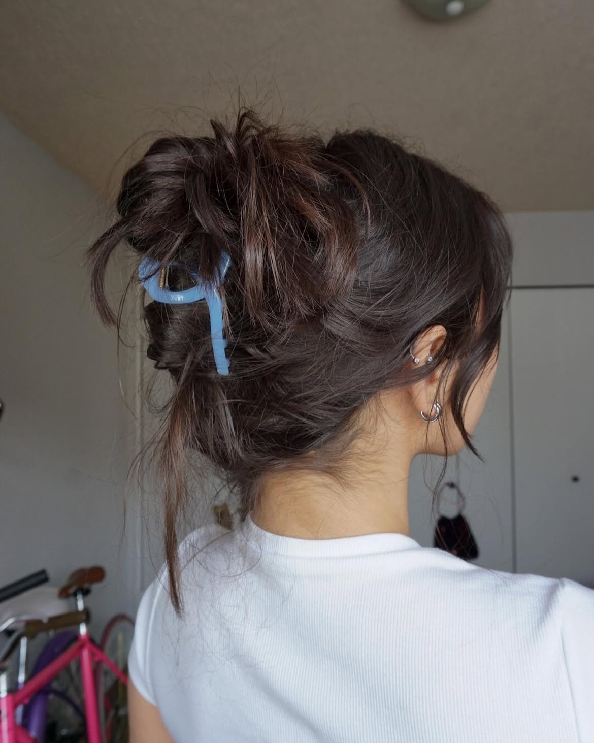 Effortless Messy Bun With Face-Framing Strands