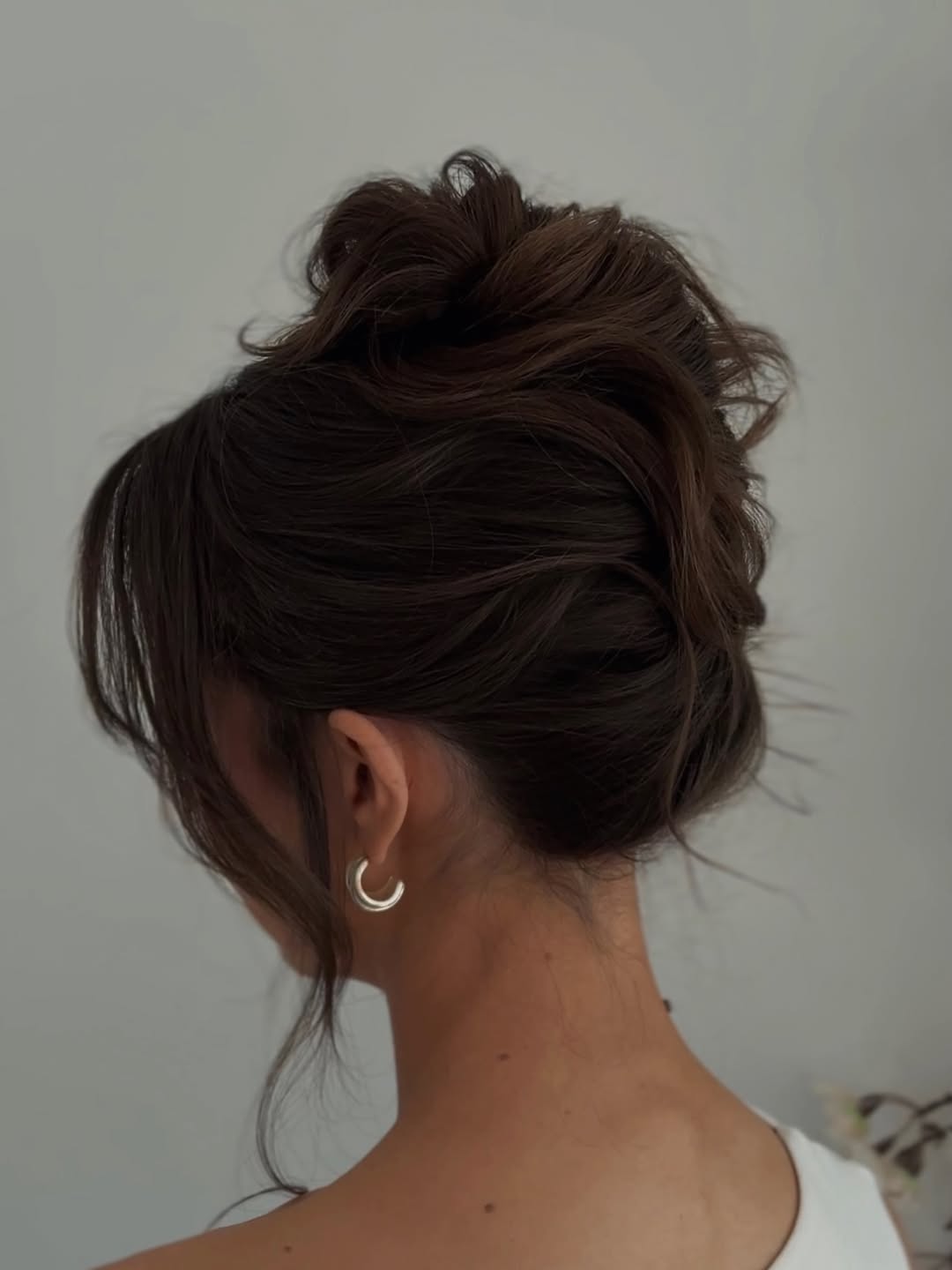 Effortless Tousled Messy Bun With Face Framing Pieces