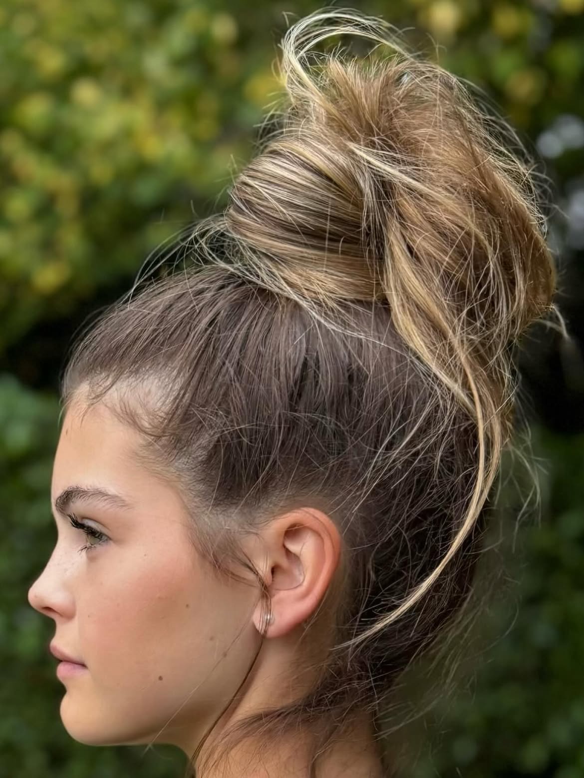 Effortless Tousled Top Knot With Face-Framing Strands