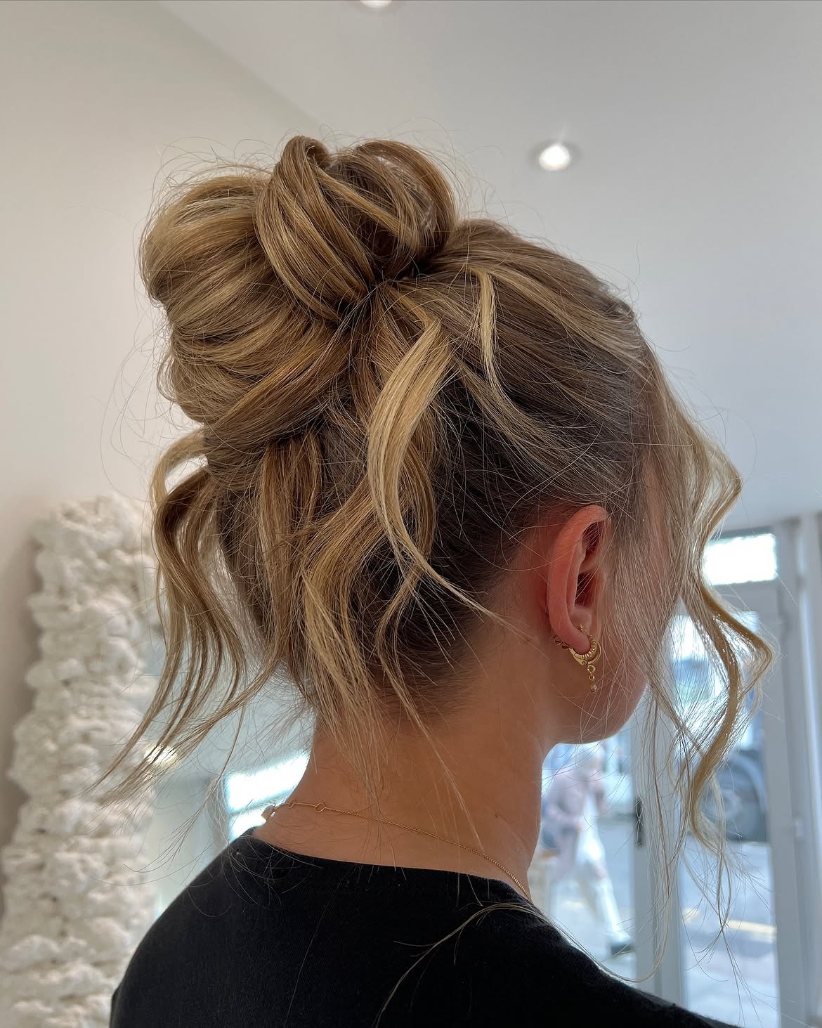 Effortless Tousled Updo With Face-Framing Strands