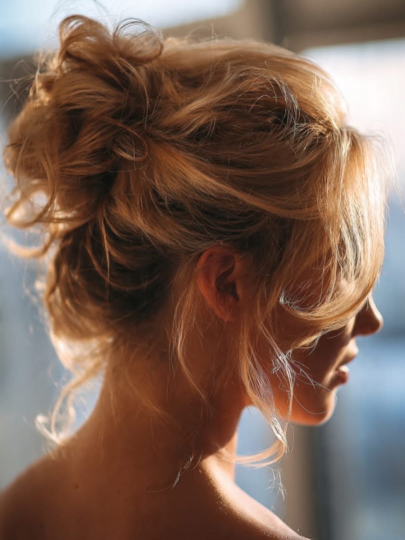 Effortless Tousled Updo With Loose Face-Framing Pieces