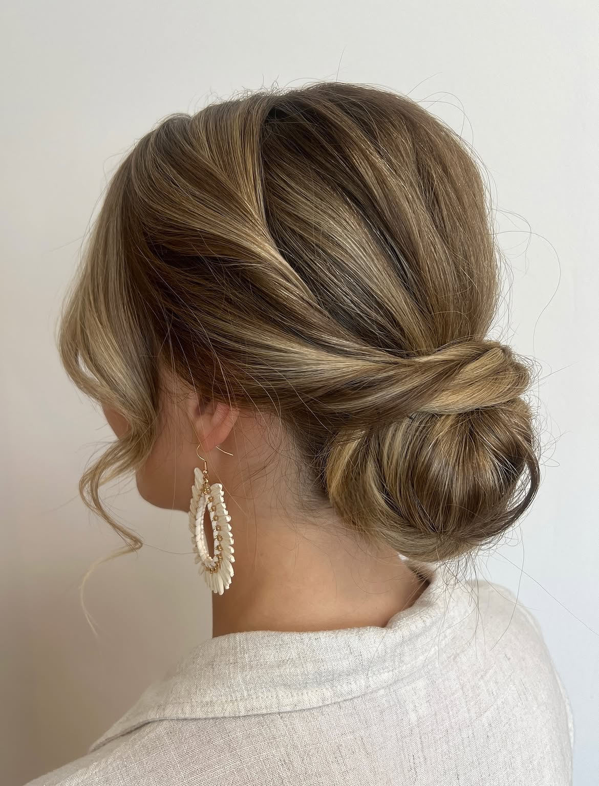 Effortless Twisted Low Bun With Face Framing Pieces