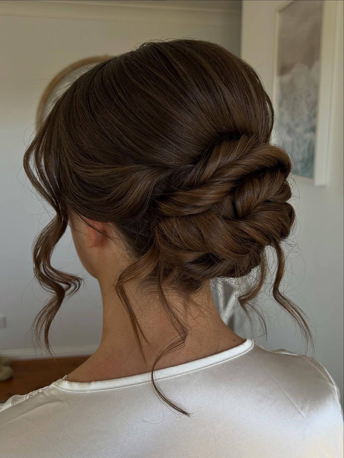 Elegant Braided Chignon With Loose Waves