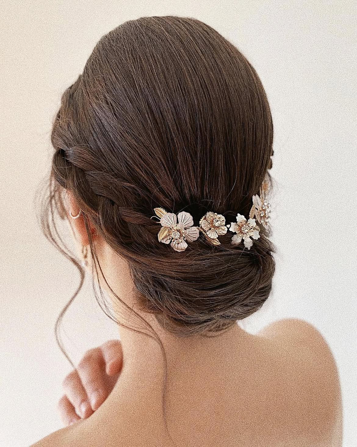 Elegant Braided Updo With Floral Hairpiece