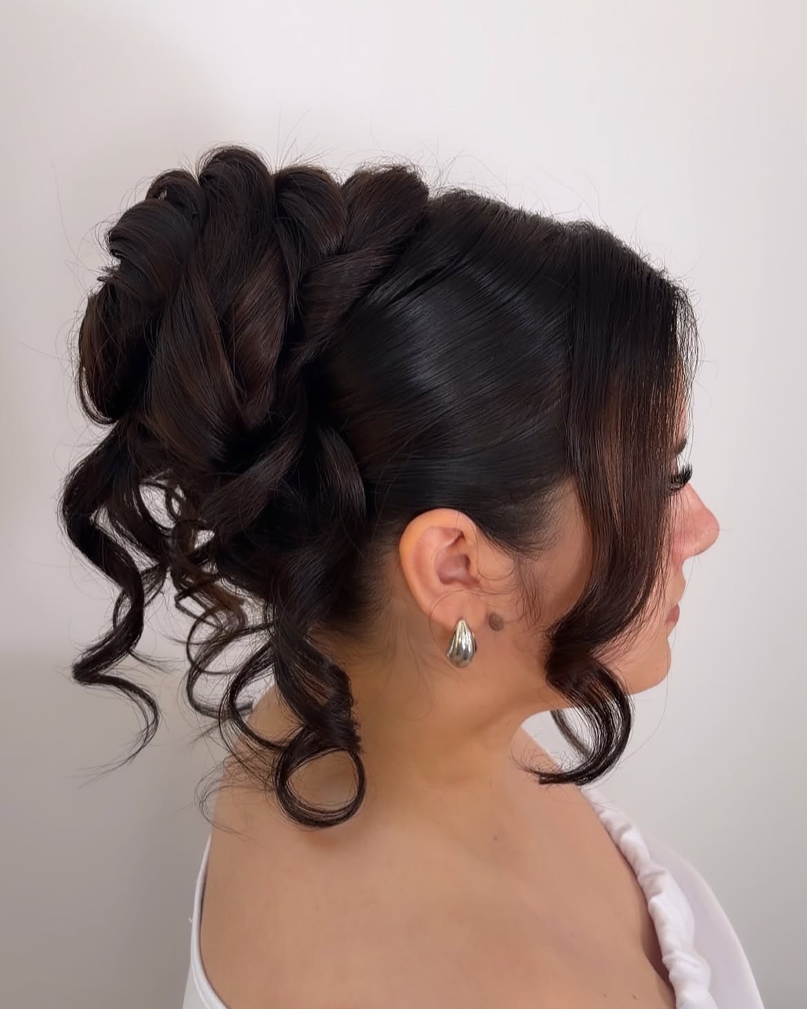 Elegant Braided Updo With Loose Curls