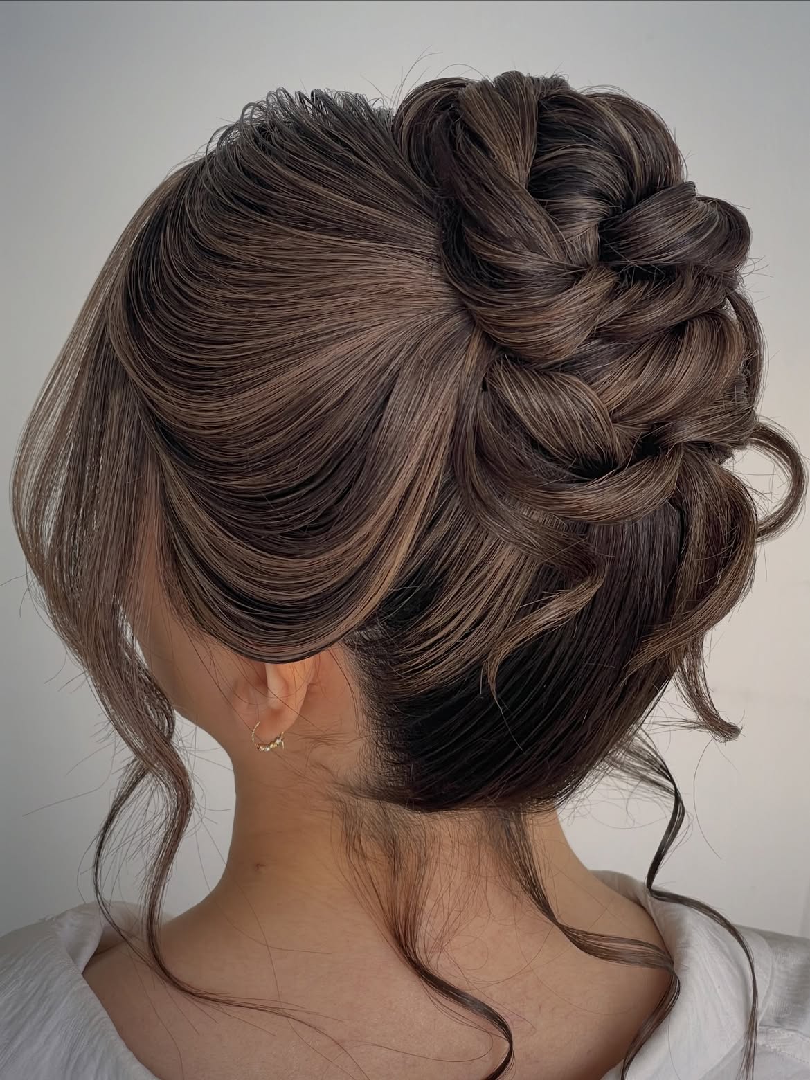 Elegant Braided Updo With Loose Face-Framing Curls