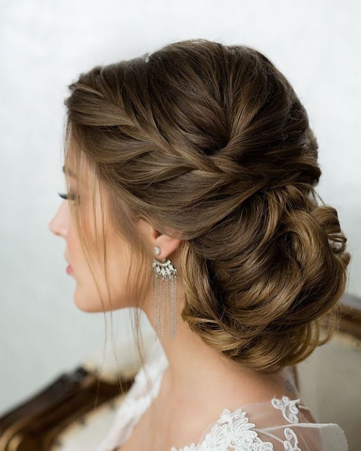 Elegant Braided Updo With Loose Tendrils