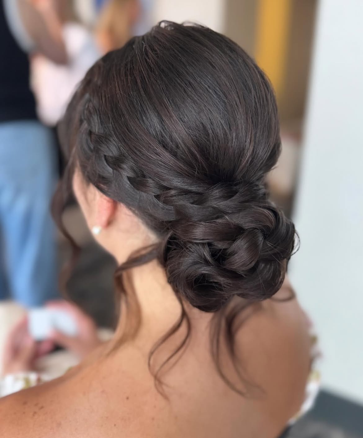 Elegant Braided Updo With Loose Tendrils