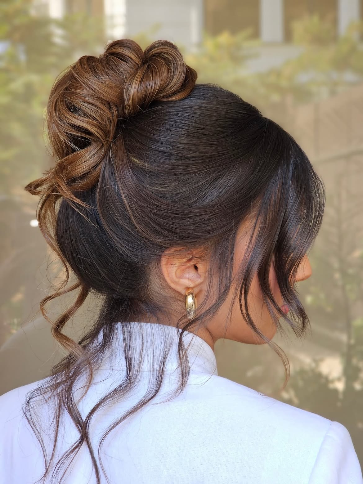 Elegant Chignon With Loose Face-Framing Curls