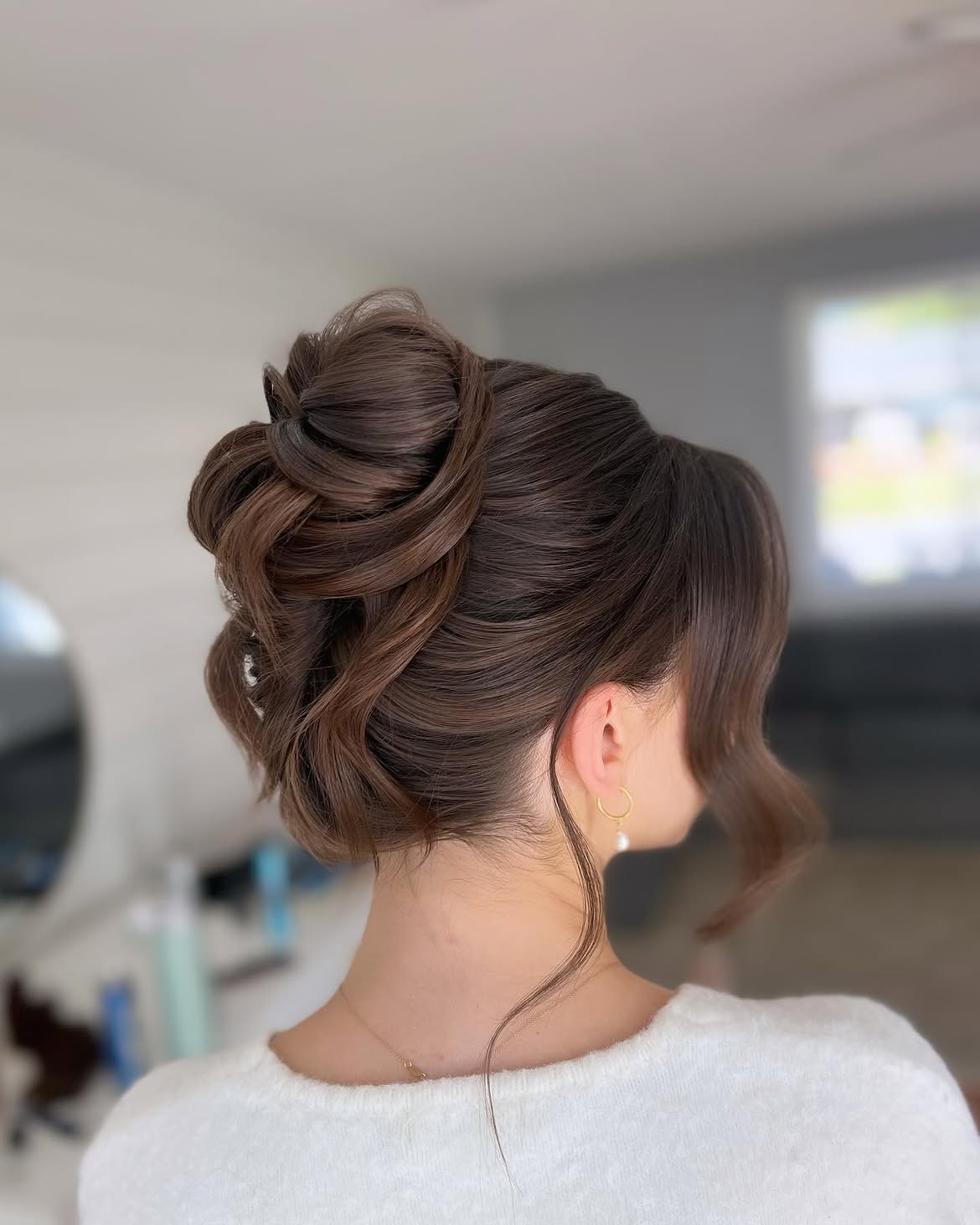 Elegant Chignon With Loose Face-Framing Tendrils