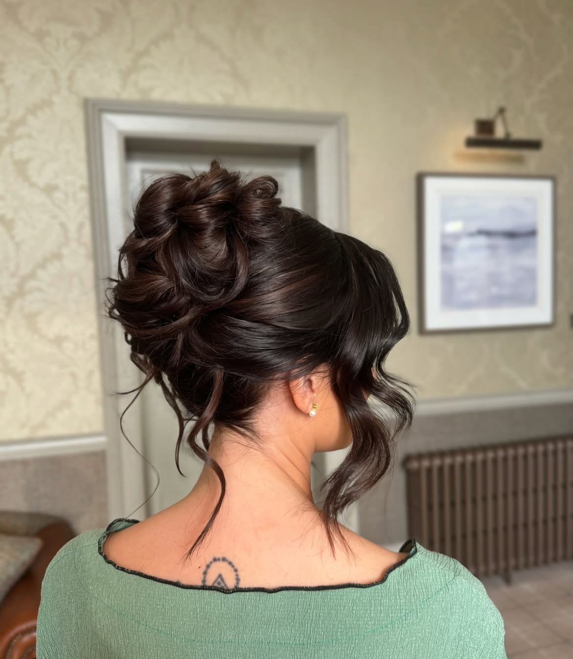 Elegant Chignon With Loose Wispy Tendrils