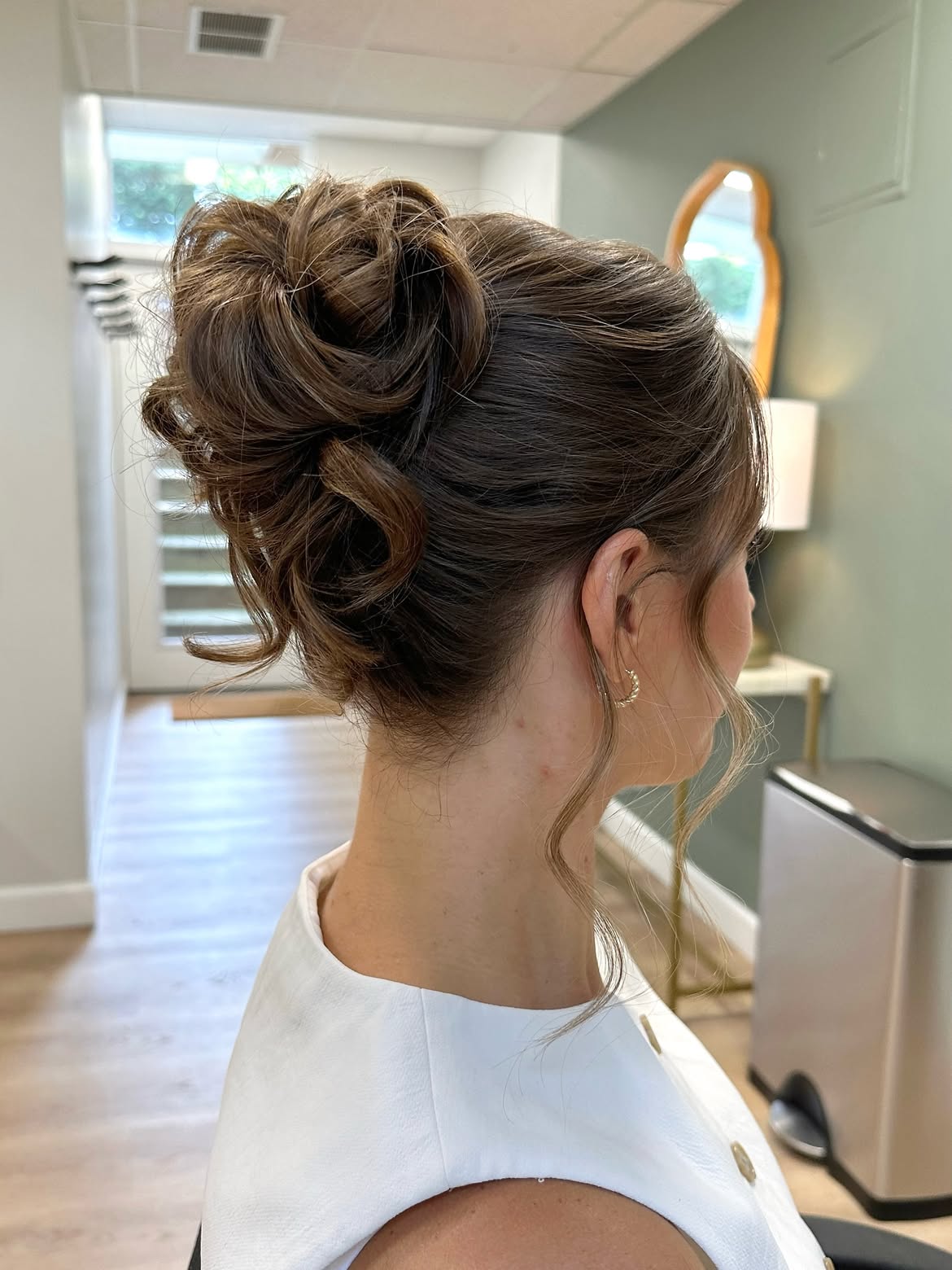 Elegant Chignon With Soft Face-Framing Tendrils