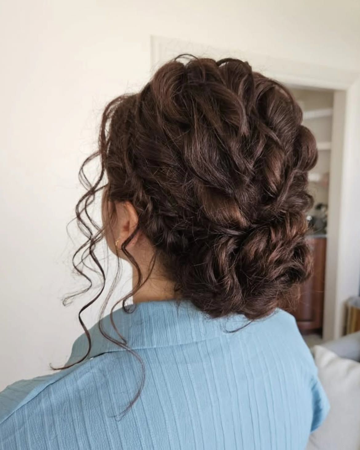 Elegant Curly Updo With Face-Framing Tendrils