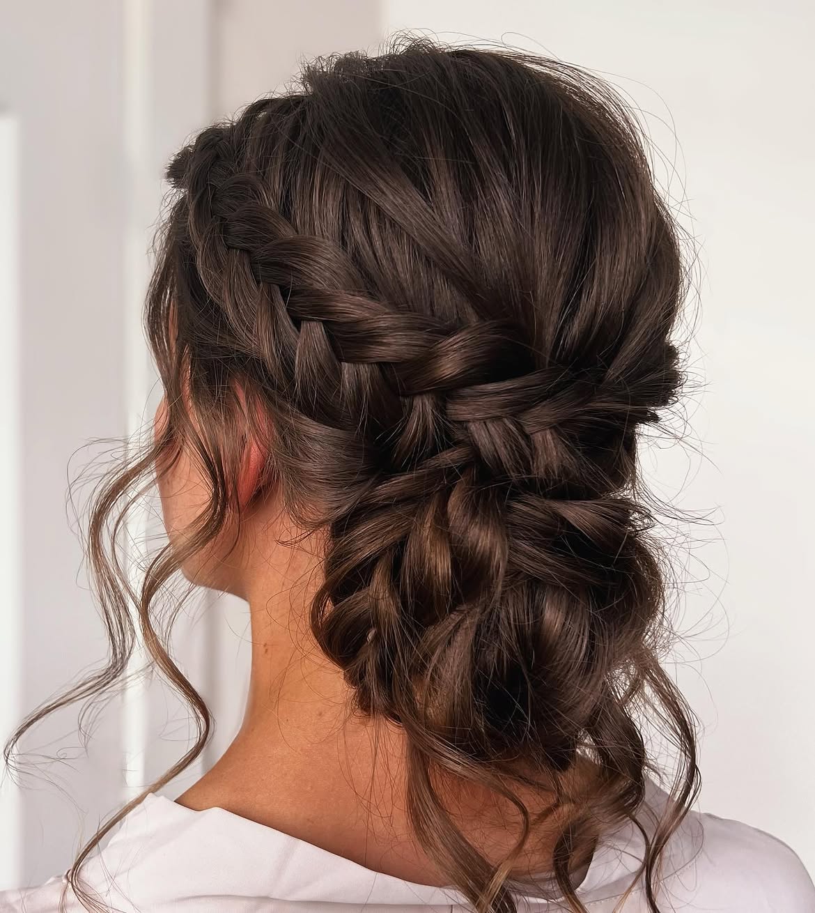 Elegant French Braid Updo With Loose Curls