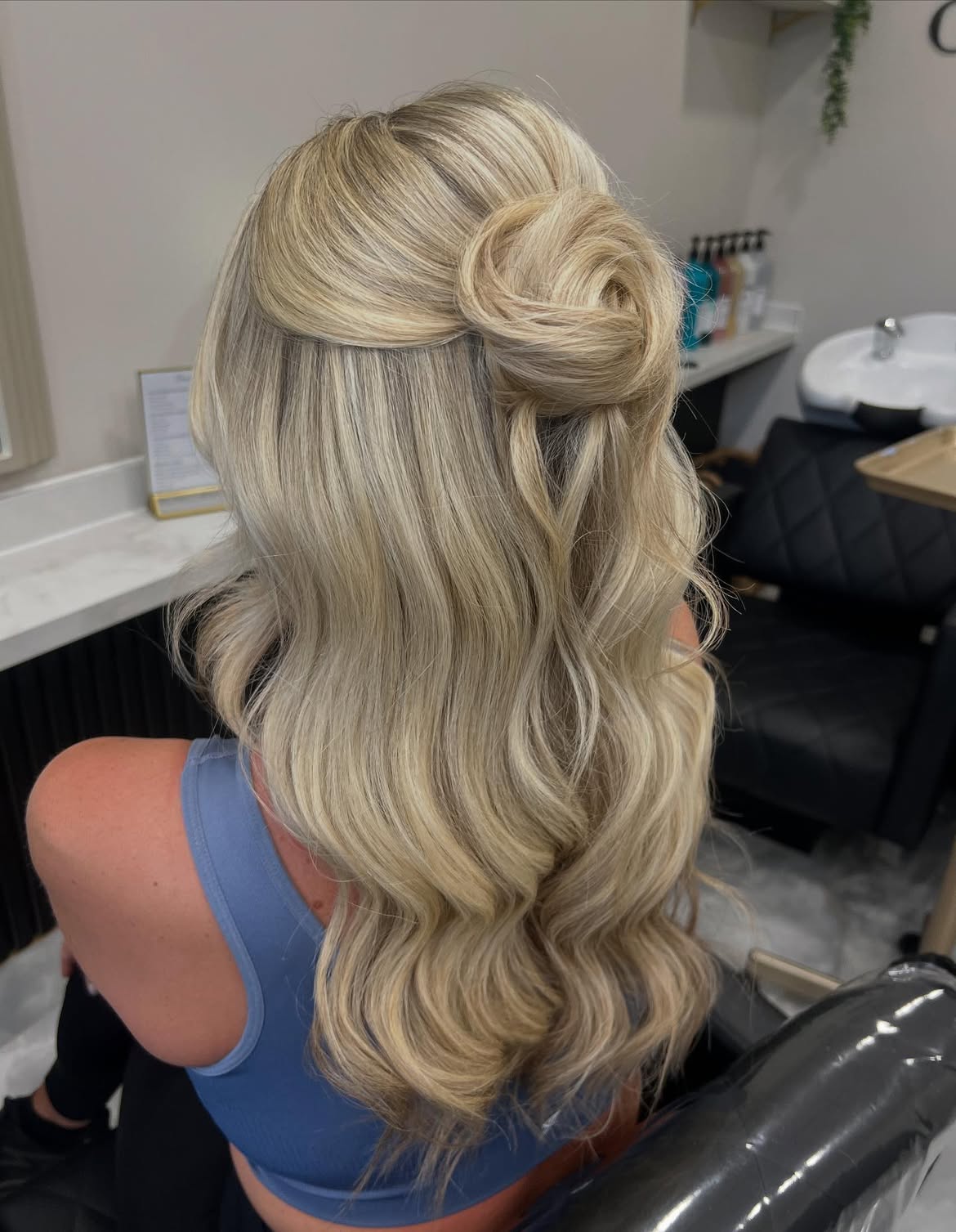 Elegant Half-Up Rose Bun With Loose Waves