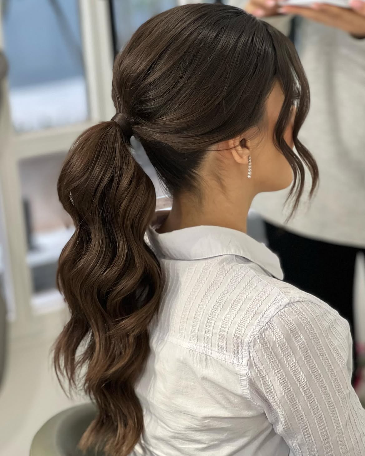 Elegant High Ponytail With Loose Face-Framing Curls