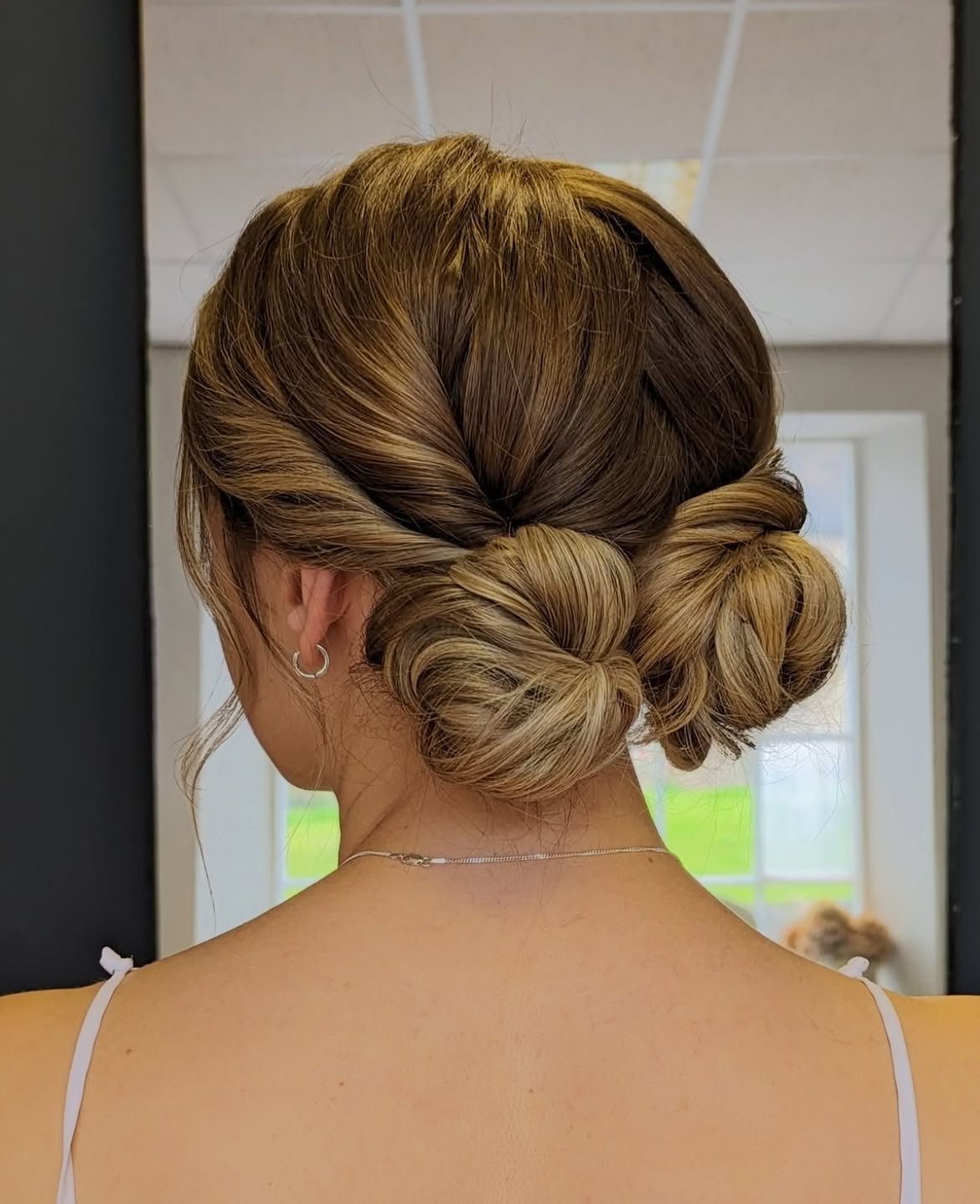 Elegant Low Twisted Double Buns Updo