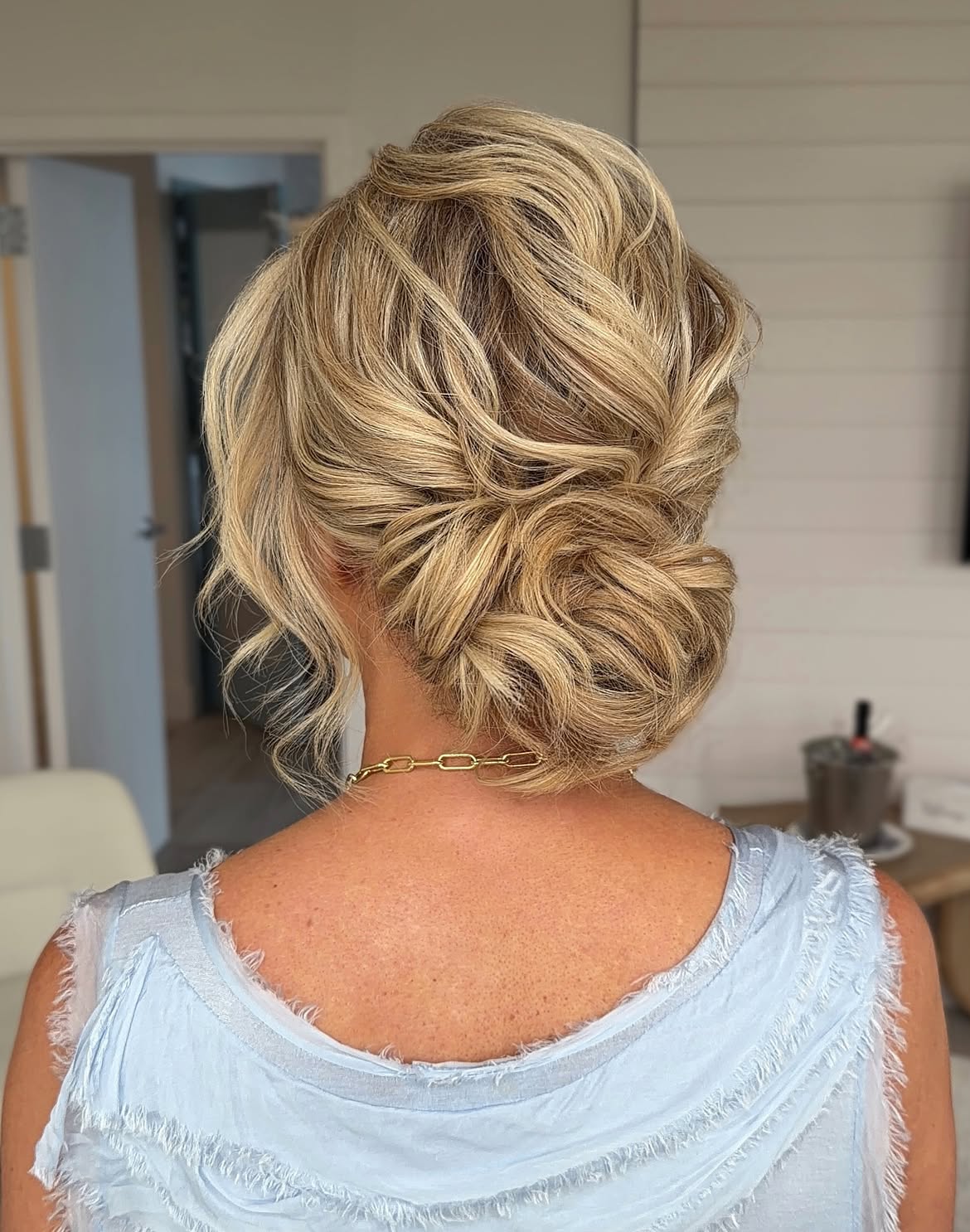 Elegant Messy Low Bun With Wispy Tendrils