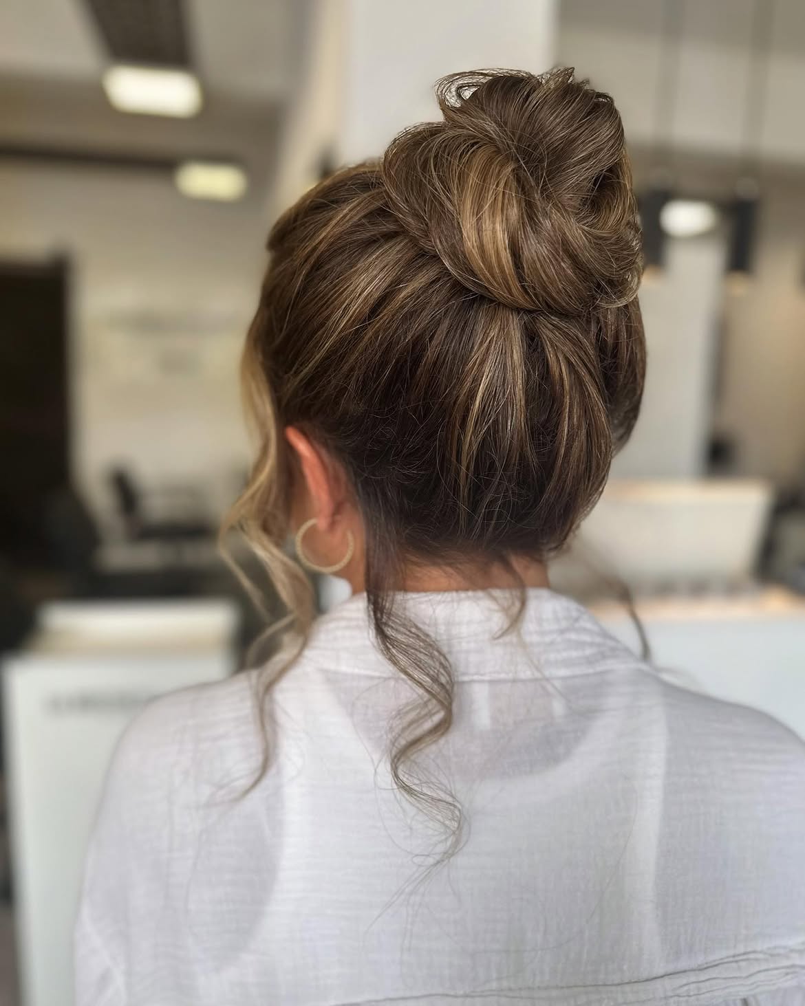 Elegant Messy Top Knot With Face-Framing Tendrils