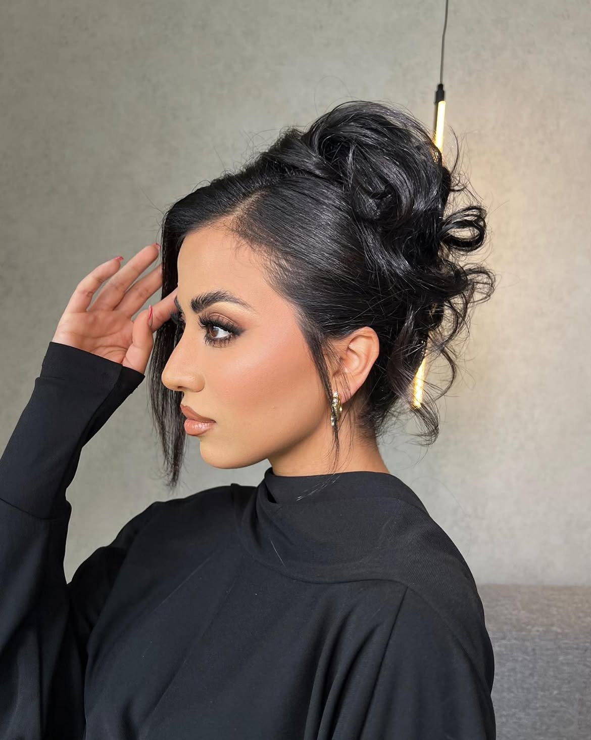 Elegant Messy Updo With Face-Framing Tendrils