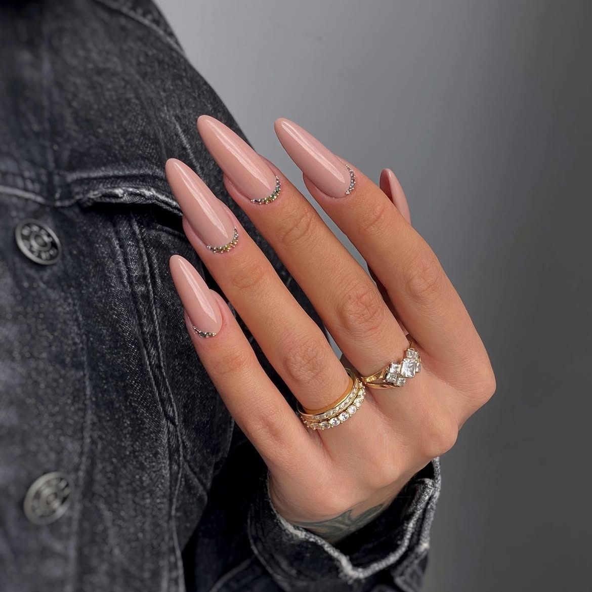 Elegant Nude Almond Nails with Crystal Embellishments