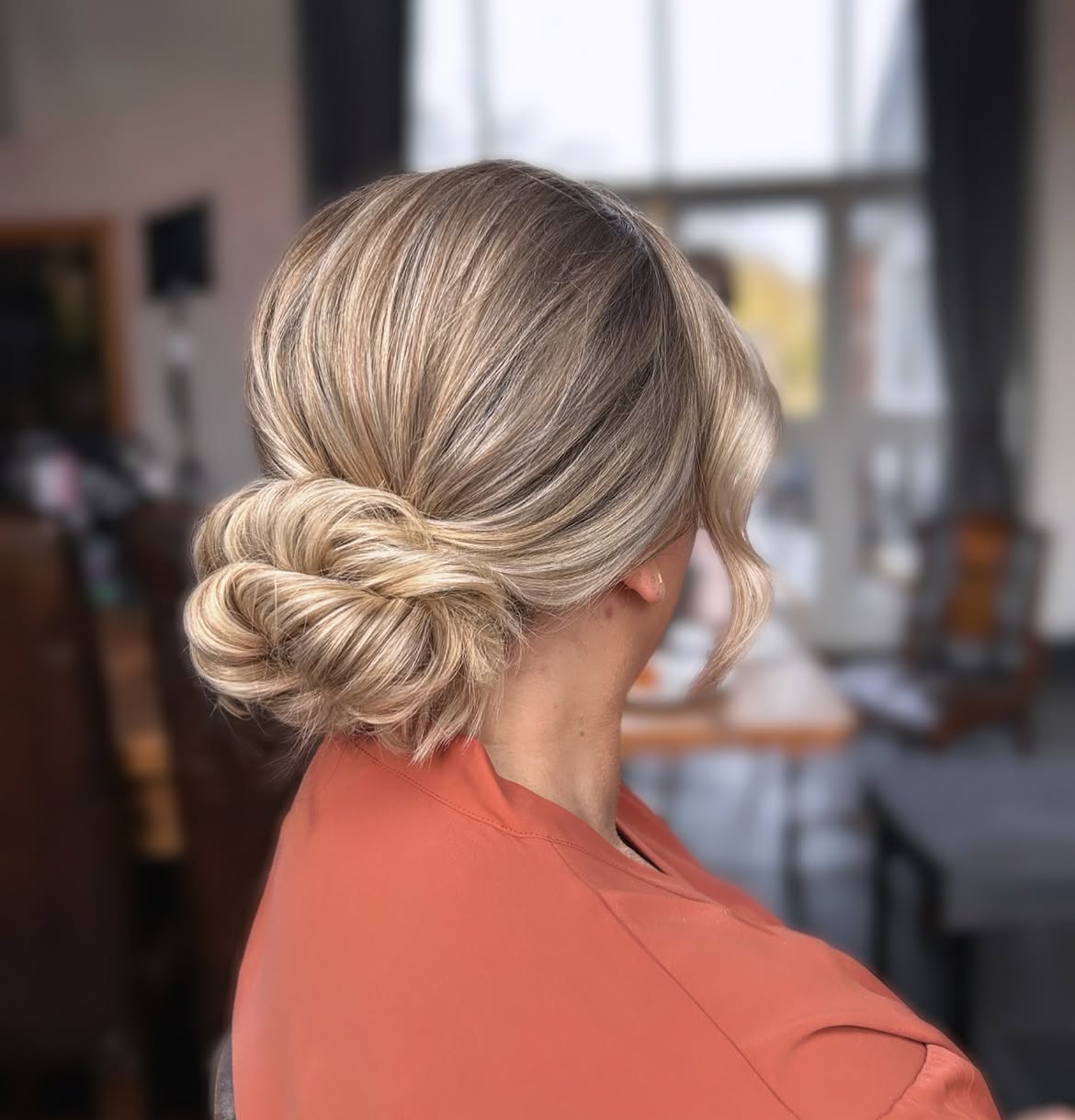 Elegant Twisted Low Bun With Face Framing Layers