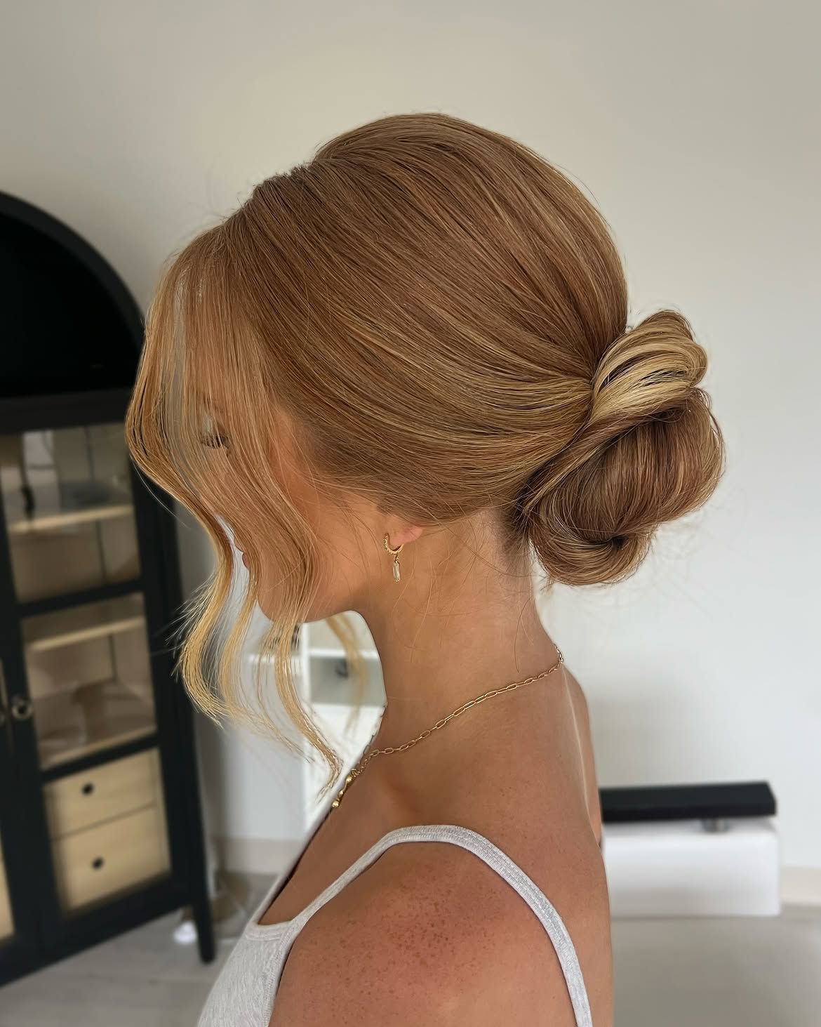 Elegant Twisted Low Bun With Face-Framing Tendrils
