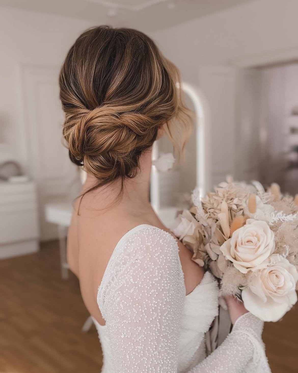 Elegant Twisted Low Bun With Loose Strands
