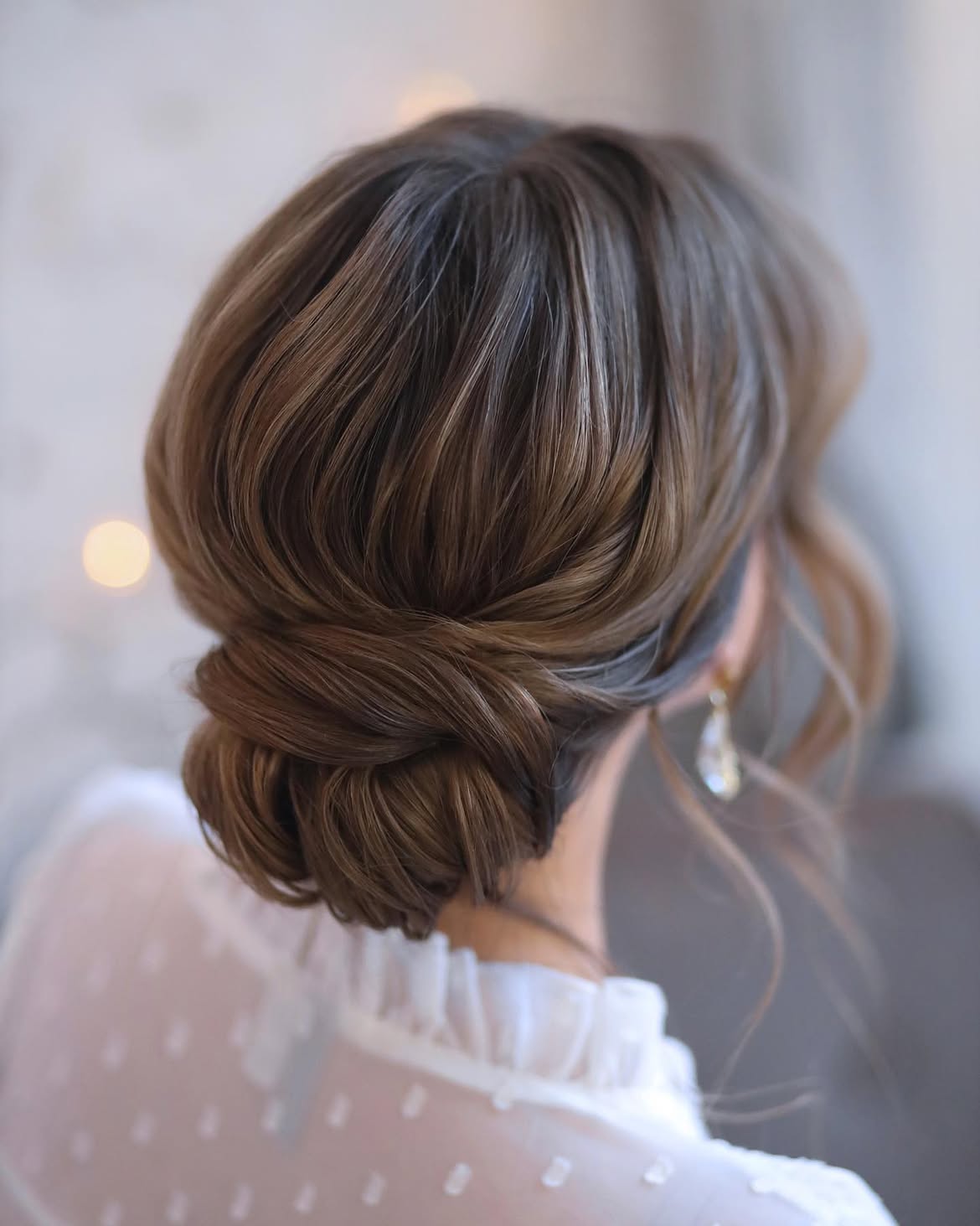 Elegant Twisted Low Bun With Subtle Highlights