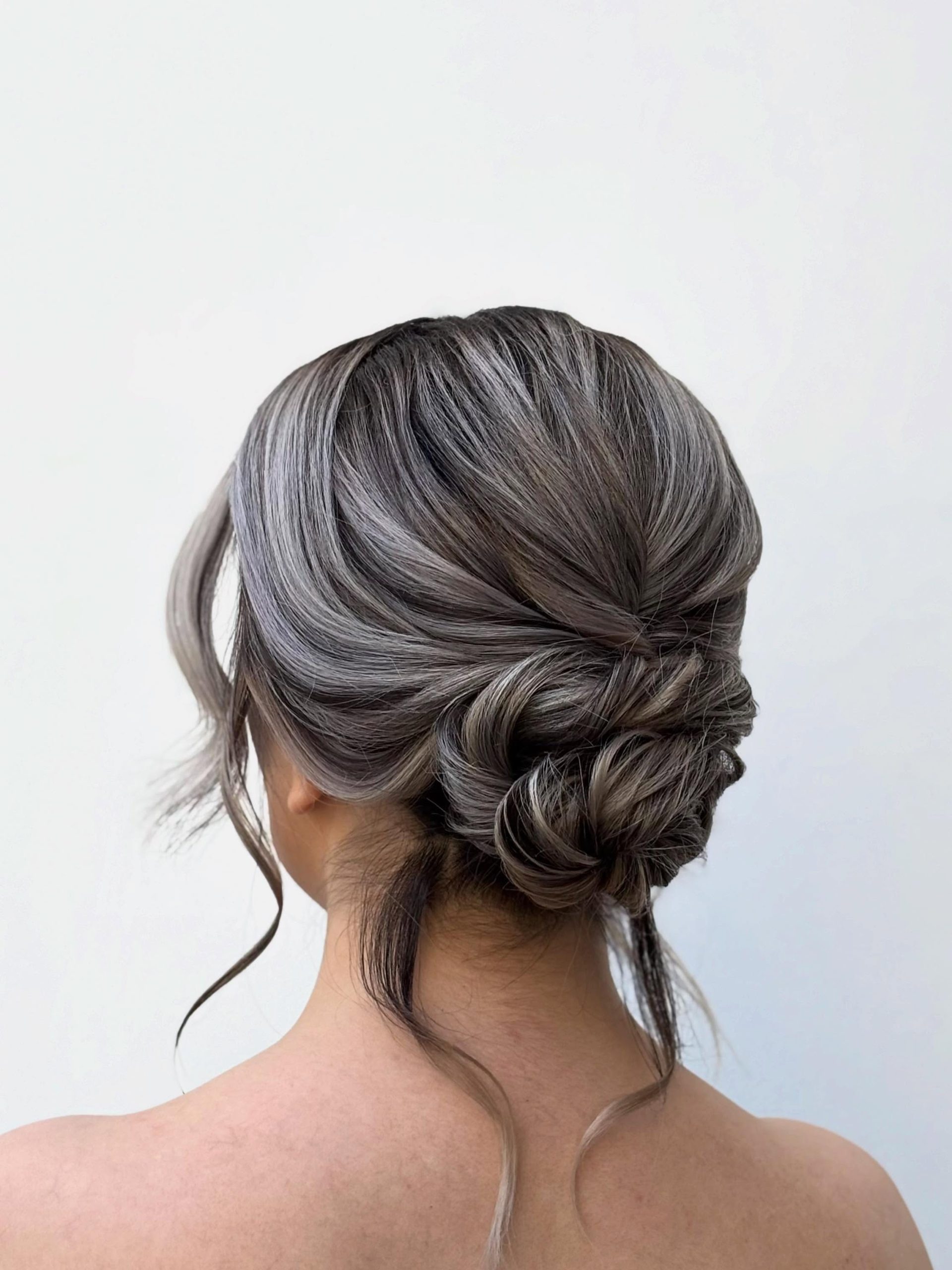 Elegant Twisted Updo With Face-Framing Strands