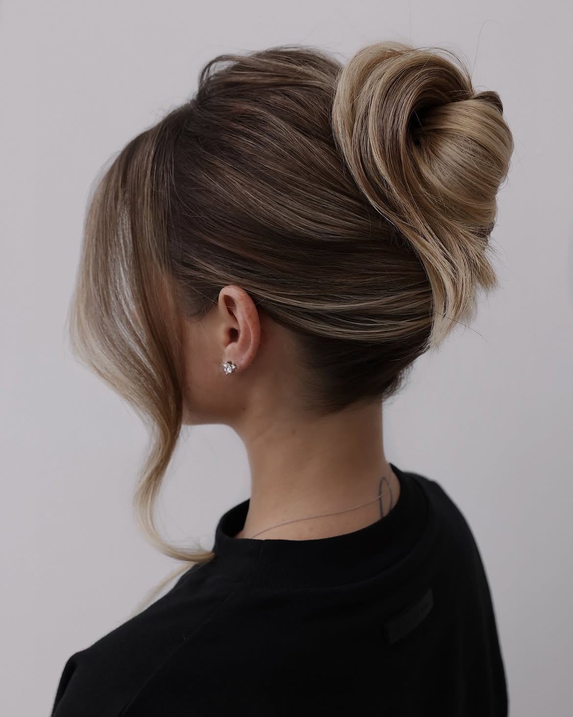 Elegant Twisted Updo With Face-Framing Tendrils