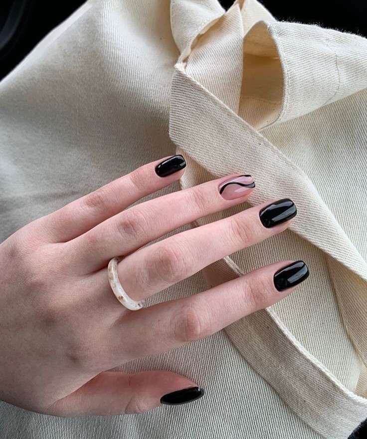 Glossy Black Oval Nails with Swirl Art