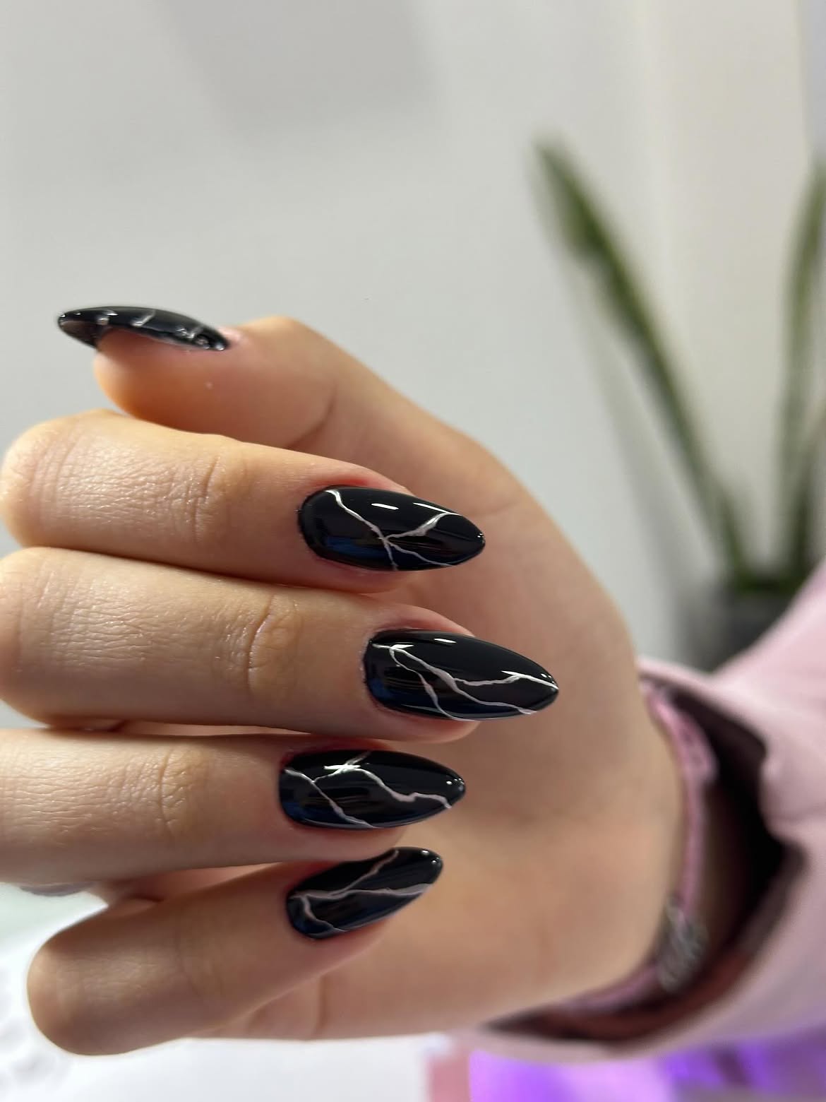 Glossy Black Oval Nails with White Marble Veins